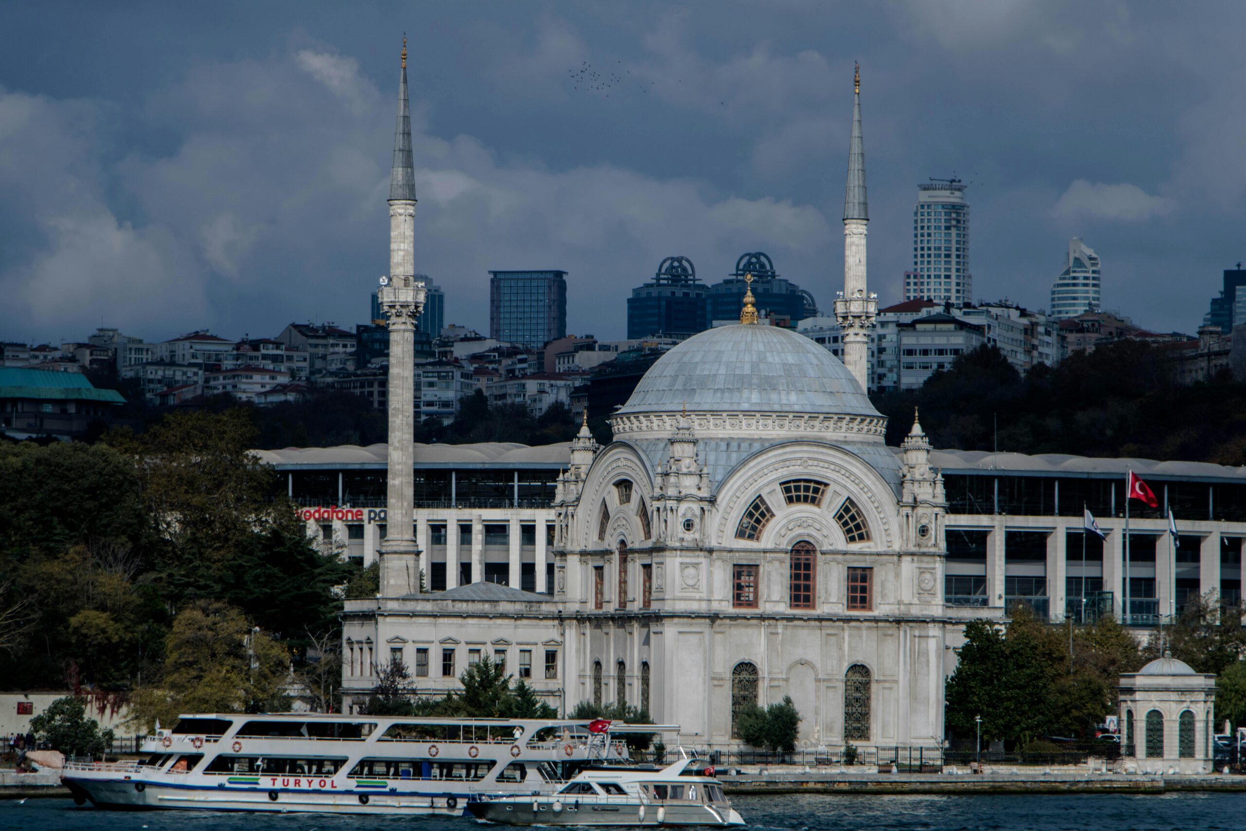 relax-atmosphere Scenic view of Ortaköy Mosque by the Bosphorus in Istanbul, showcasing a blend of history and modern cityscape.