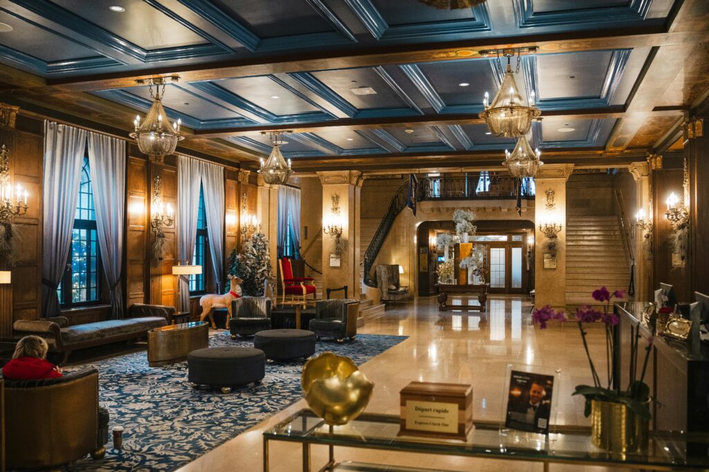 Luxurious hotel lobby in Québec, Canada featuring elegant decor and grand chandeliers.