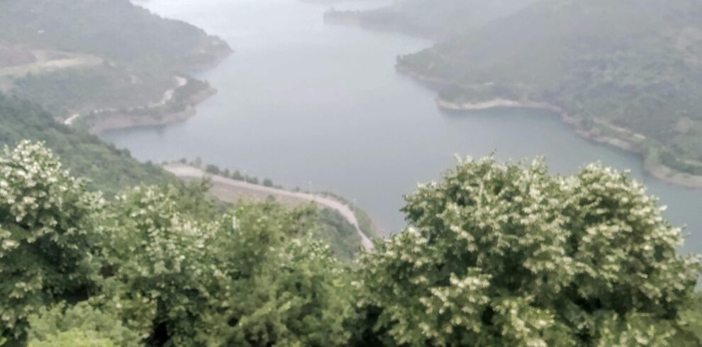 Relaxing moment with Turkish tea and a breathtaking view of a lake and mountains from Maşukiye, Kocaeli.