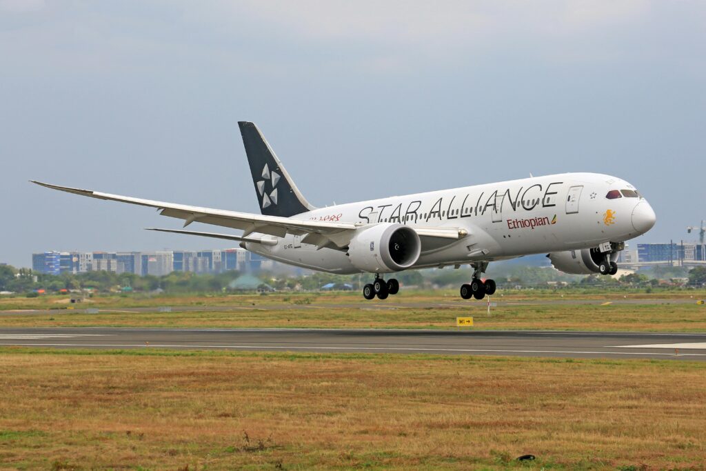Ethiopian Airlines Boeing 787 landing on runway with Star Alliance livery.