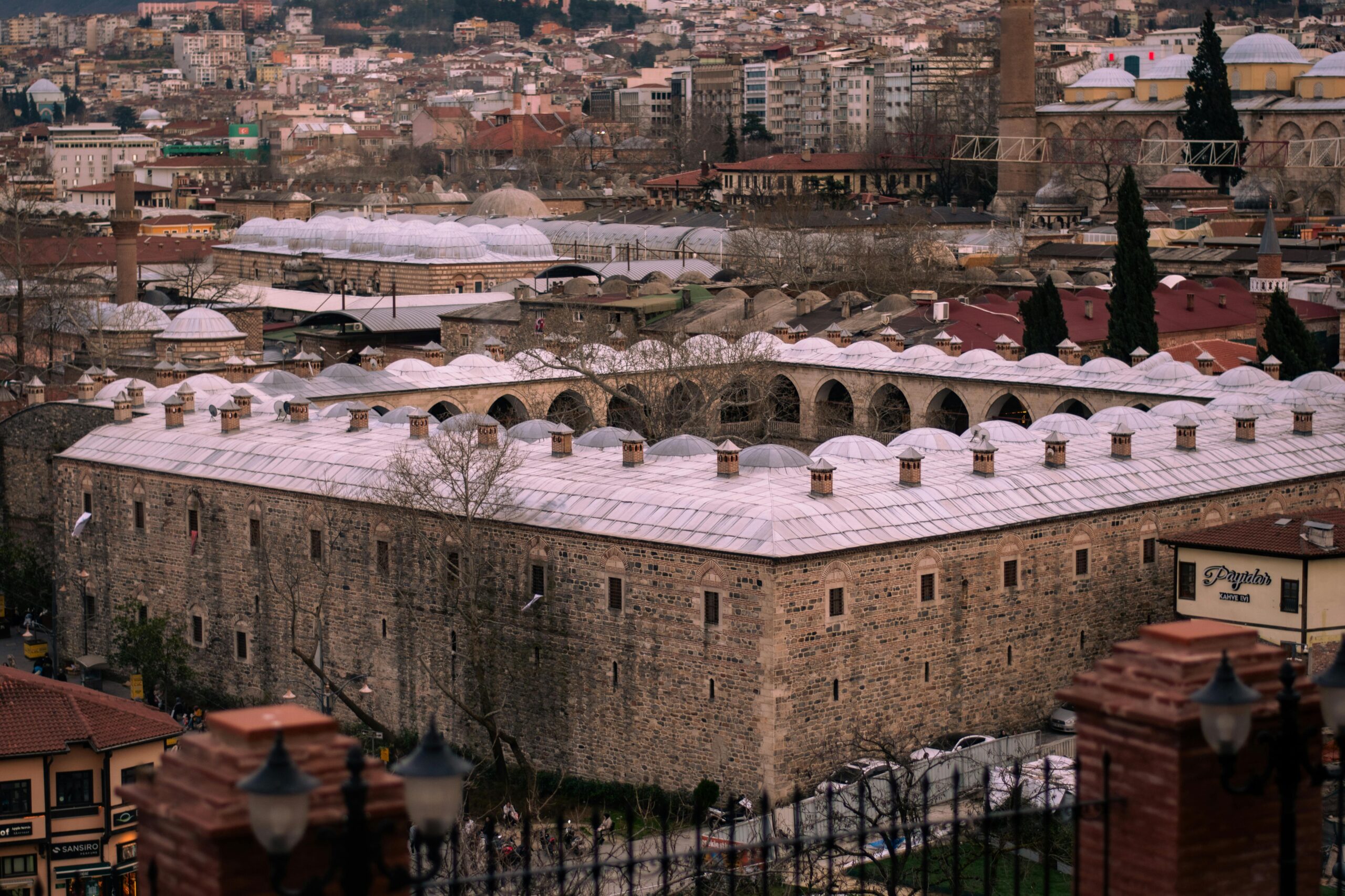 Aerial view of historic Ottoman architecture in Bursa, Türkiye, showcasing the city's unique cultural heritage.